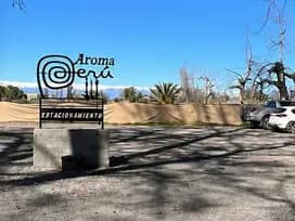 Customer parking next to the Aroma Perú sign